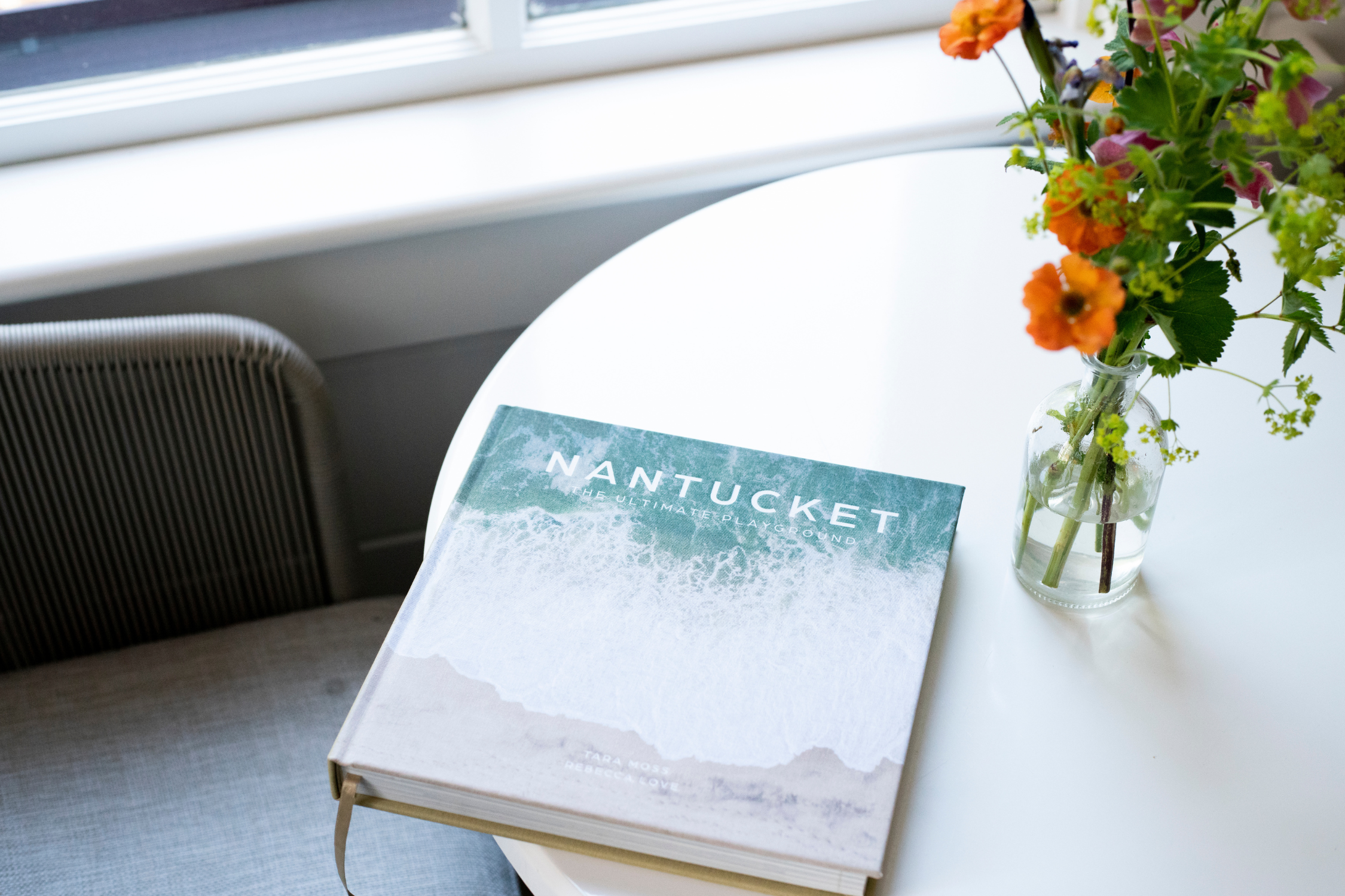 Coffee Table Book And Flowers